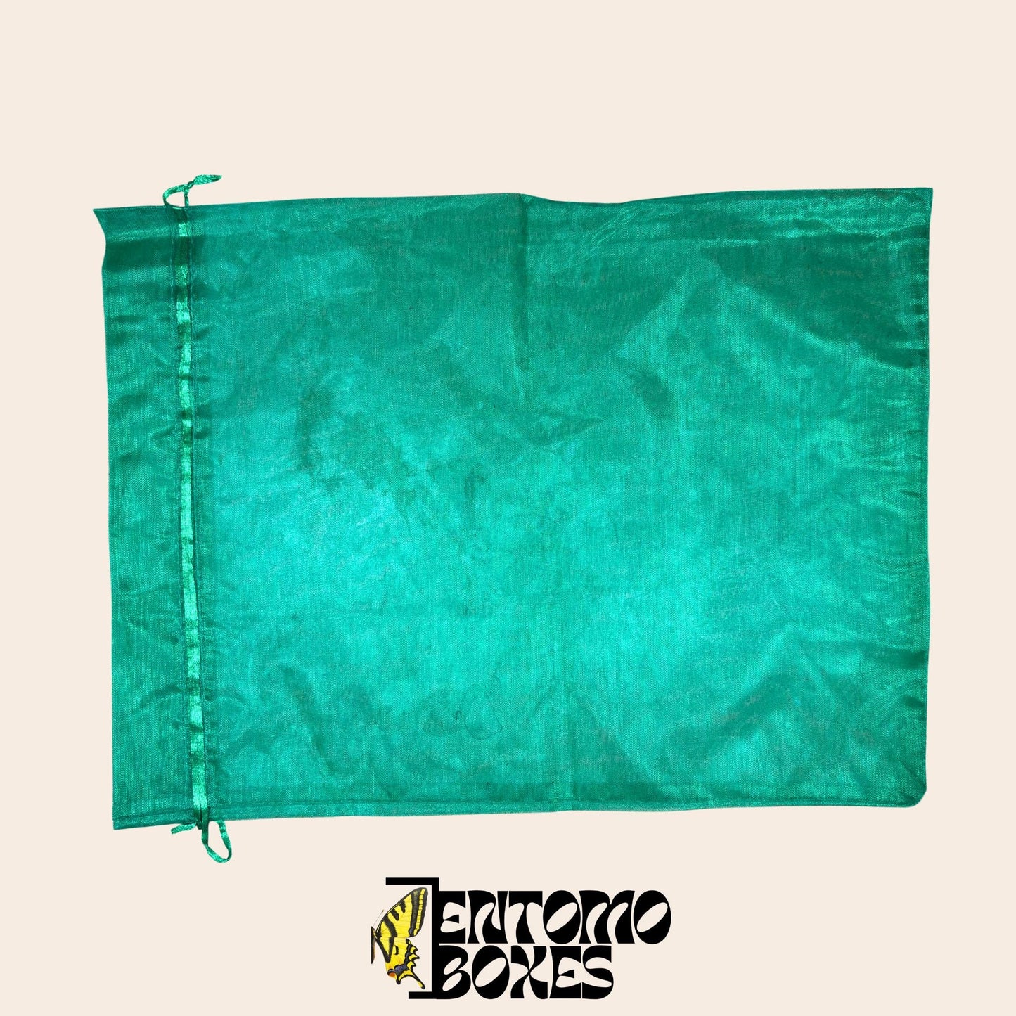 Green fine mesh insect breeding bag with drawstring closure, laid flat on a beige background.