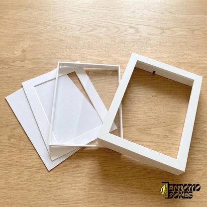 Shadow box frame taken apart: frame, clear plexiglass front, white mat and backing board