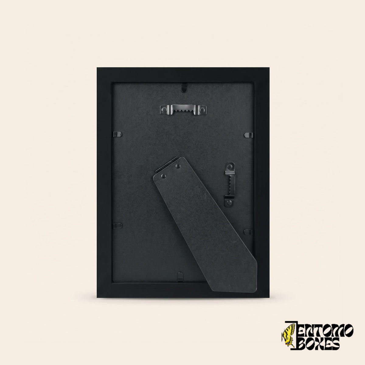 Back of the shadow box frame with fold-out easel stand and wall hangers